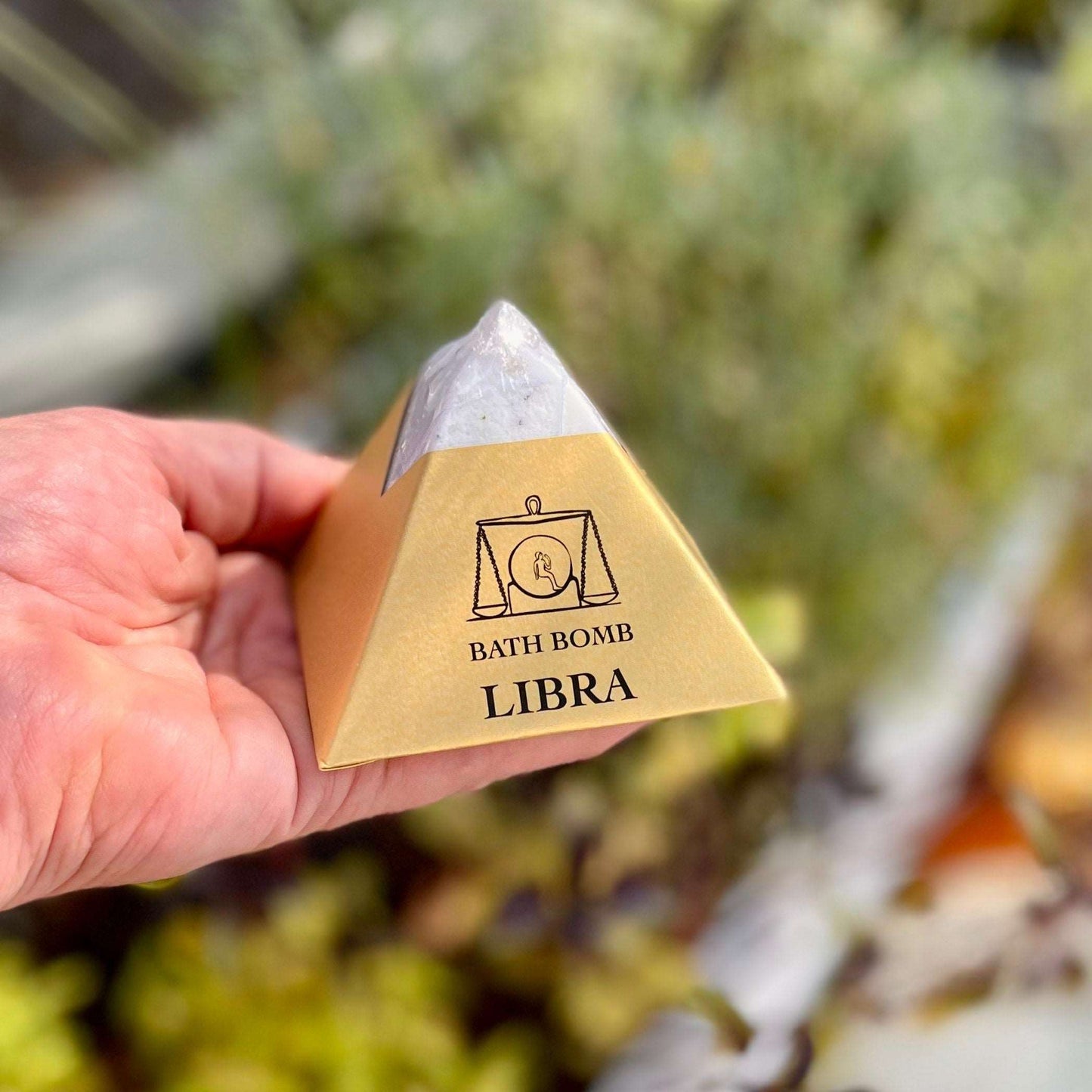 Elevate your bath ritual with our Libra Bath Bomb, harmoniously blending organic essential oils of Lemongrass, Rosemary, and Peppermint. Designed to balance and soothe, this bath bomb invites a sense of equilibrium and tranquility into your self-care routine. Immerse yourself in the fragrant embrace of these luxurious scents, while the nourishing ingredients pamper your senses. Embrace the essence of Libra and find serenity in this delightful bath experience.