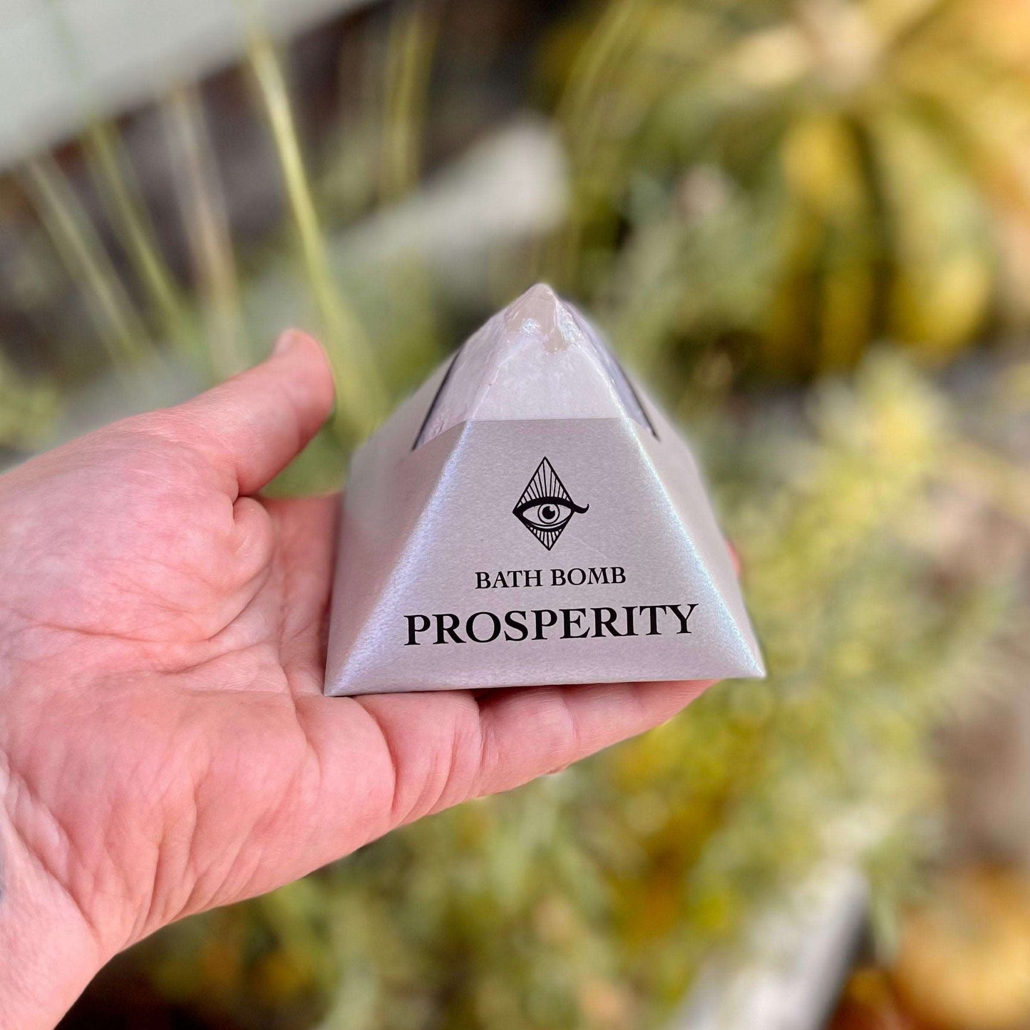 Invite abundance into your bath ritual with our Prosperity Bath Bomb, crafted with a blend of organic Patchouli, Orange, and Clove essential oils. Immerse yourself in the opulent scents as you soak, embracing a sense of prosperity and positive energy. Indulge in the luxurious ingredients that nurture both your body and spirit, creating a bathing experience filled with richness and intention.